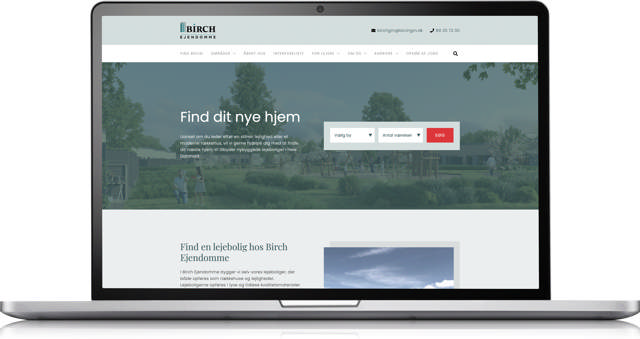 Et mockup af en bærbar computer, som viser Birch Ejendommes hjemmeside